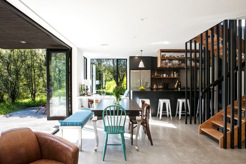 Modern kitchen in Auckland with black cabinets.