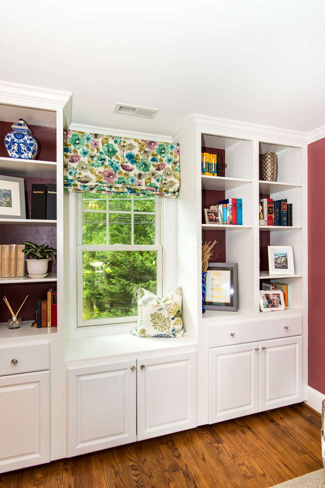 Inspiration for a mid-sized traditional study room in DC Metro with pink walls, medium hardwood floors, no fireplace, a freestanding desk and brown floor.