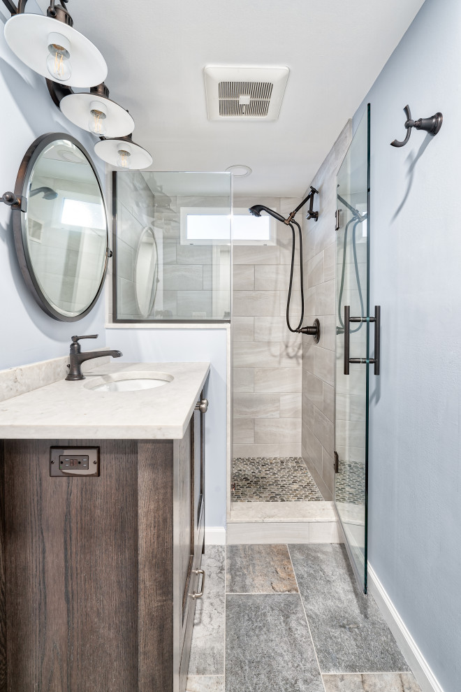 This is an example of a small country bathroom in New York with recessed-panel cabinets, medium wood cabinets, a two-piece toilet, gray tile, an undermount sink, copper benchtops, grey floor, a hinged shower door, white benchtops, a niche, a single vanity and a freestanding vanity.