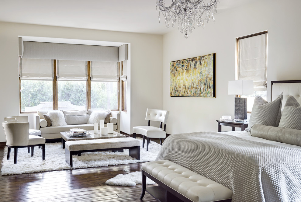 Inspiration for a mediterranean master bedroom in Phoenix with white walls and dark hardwood floors.