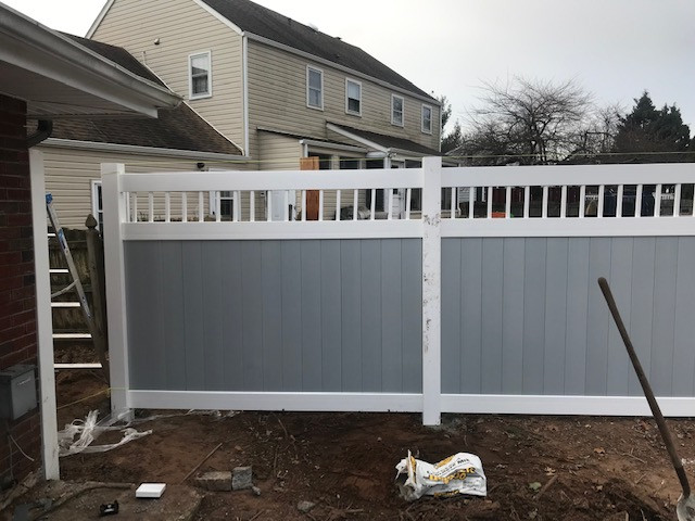 Fence installation after patio and retaining wall