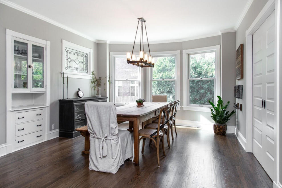 Design ideas for a large country separate dining room in Chicago with grey walls, dark hardwood floors and brown floor.