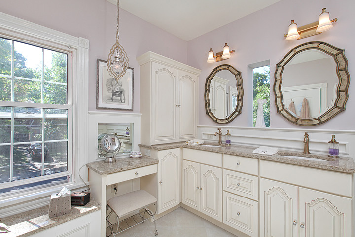 Photo of a large traditional master bathroom in Philadelphia with raised-panel cabinets, engineered quartz benchtops, purple walls, porcelain floors, an undermount sink, an alcove shower, gray tile, porcelain tile and white cabinets.