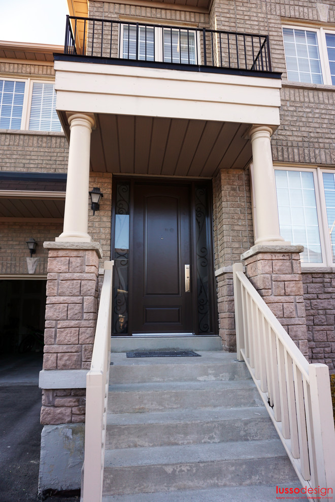 Front door - transitional front door idea in Toronto with a brown front door