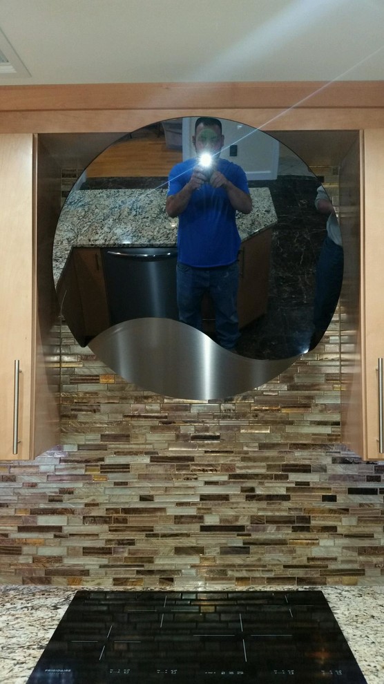 Home design - huge transitional u-shaped marble floor home design idea in Newark with an undermount sink, flat-panel cabinets, light wood cabinets, granite countertops, brown backsplash, mosaic tile backsplash and stainless steel appliances