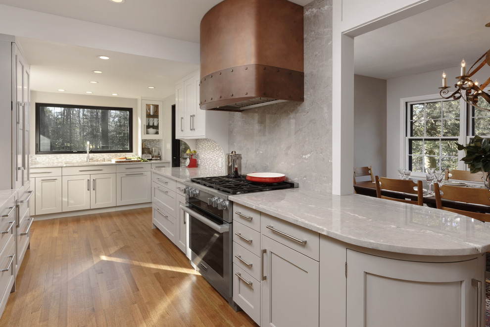 Design ideas for a large transitional eat-in kitchen in DC Metro with shaker cabinets, grey cabinets, quartzite benchtops, grey splashback, stainless steel appliances, medium hardwood floors, a peninsula, grey benchtop and stone slab splashback.
