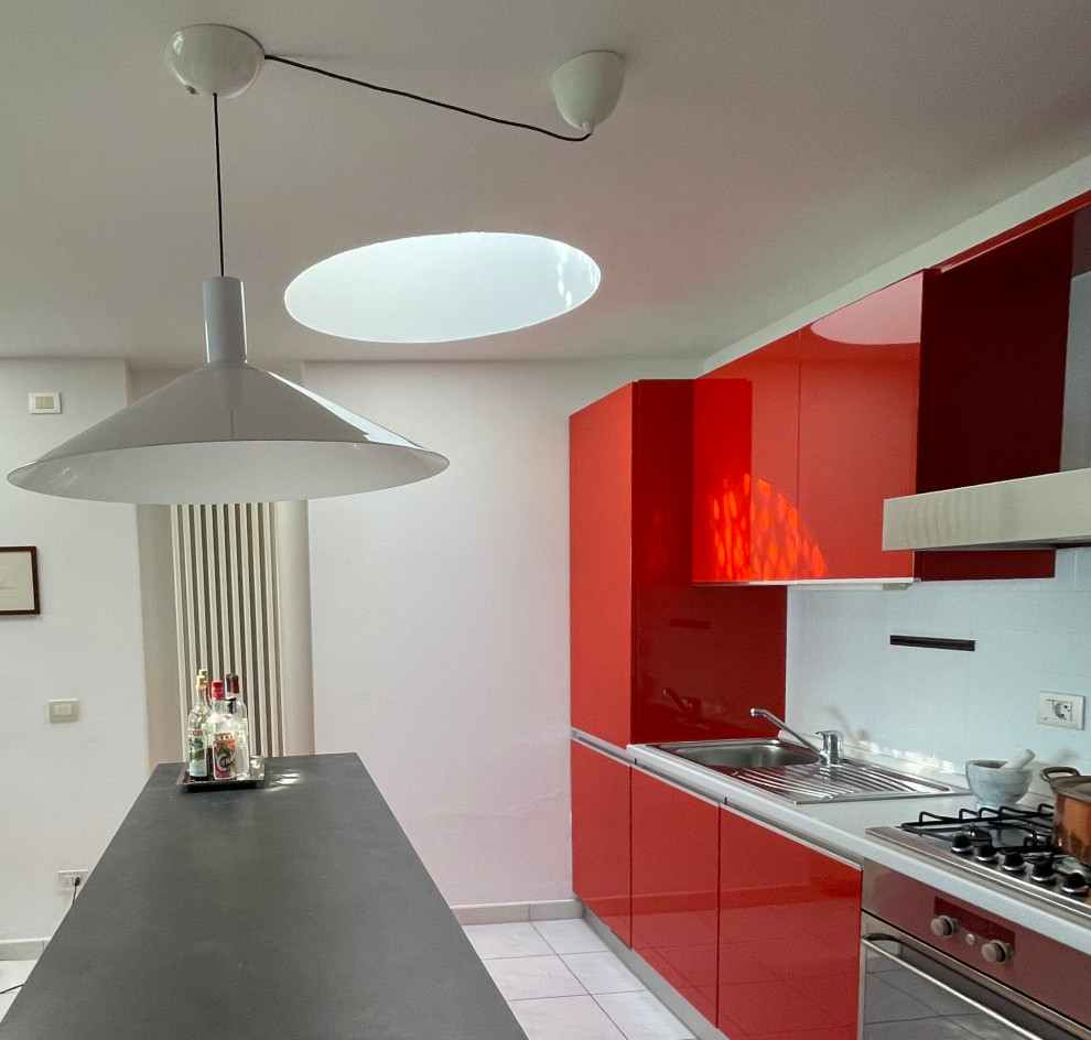 Design ideas for a small contemporary galley eat-in kitchen in Other with a single-bowl sink, flat-panel cabinets, red cabinets, laminate benchtops, white splashback, engineered quartz splashback, panelled appliances, porcelain floors, with island, white floor, grey benchtop and recessed.