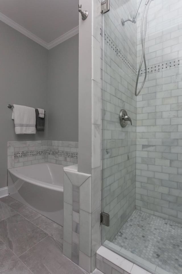 Design ideas for a mid-sized contemporary master bathroom in Charleston with grey cabinets, gray tile, subway tile, grey walls and ceramic floors.