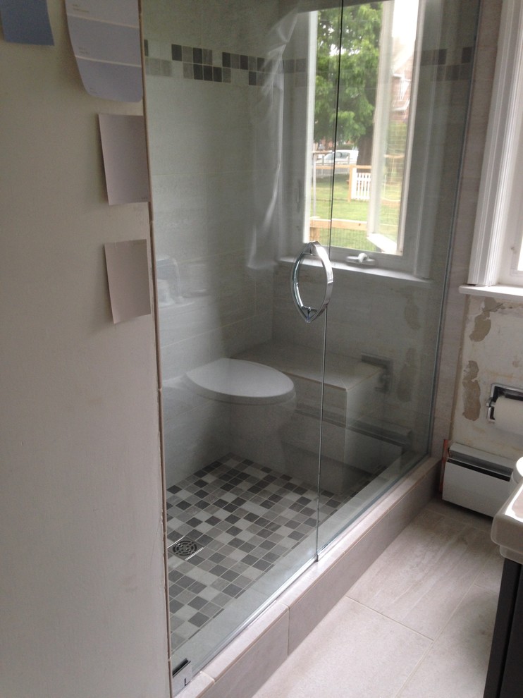 Alcove shower - transitional 3/4 beige tile and ceramic tile ceramic tile and beige floor alcove shower idea with beige walls and a hinged shower door