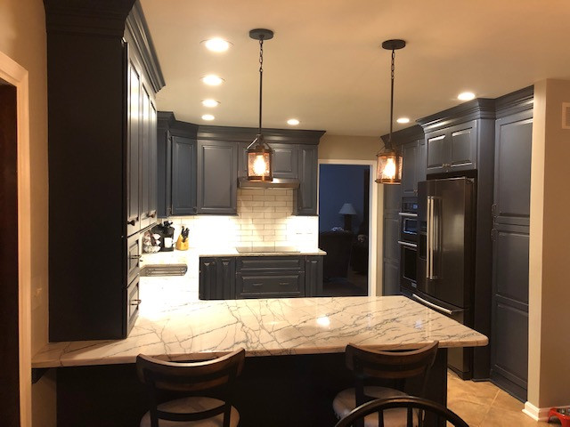 Dark Blue Cabinetry Makes for a Warm & Welcoming Kitchen
