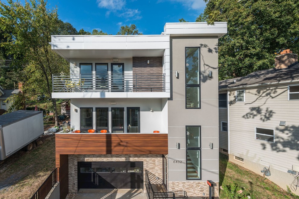 Large contemporary gray three-story mixed siding flat roof idea in DC Metro
