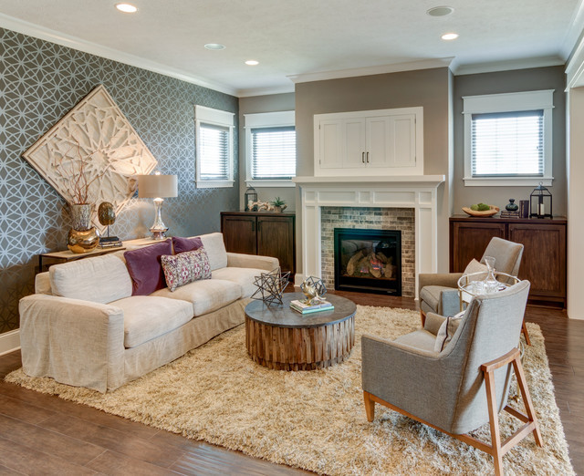 Mid-sized contemporary formal enclosed living room in Indianapolis with multi-coloured walls, medium hardwood floors, a standard fireplace, a brick fireplace surround and no tv.
