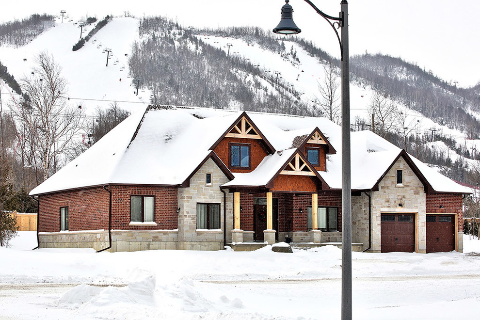 Mid-sized arts and crafts multicolored split-level mixed siding house exterior photo in Other with a shingle roof