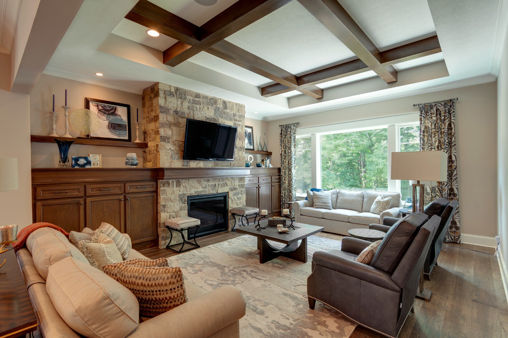 Mid-sized country open concept living room in Indianapolis with beige walls, vinyl floors, a standard fireplace, a stone fireplace surround, a wall-mounted tv and brown floor.