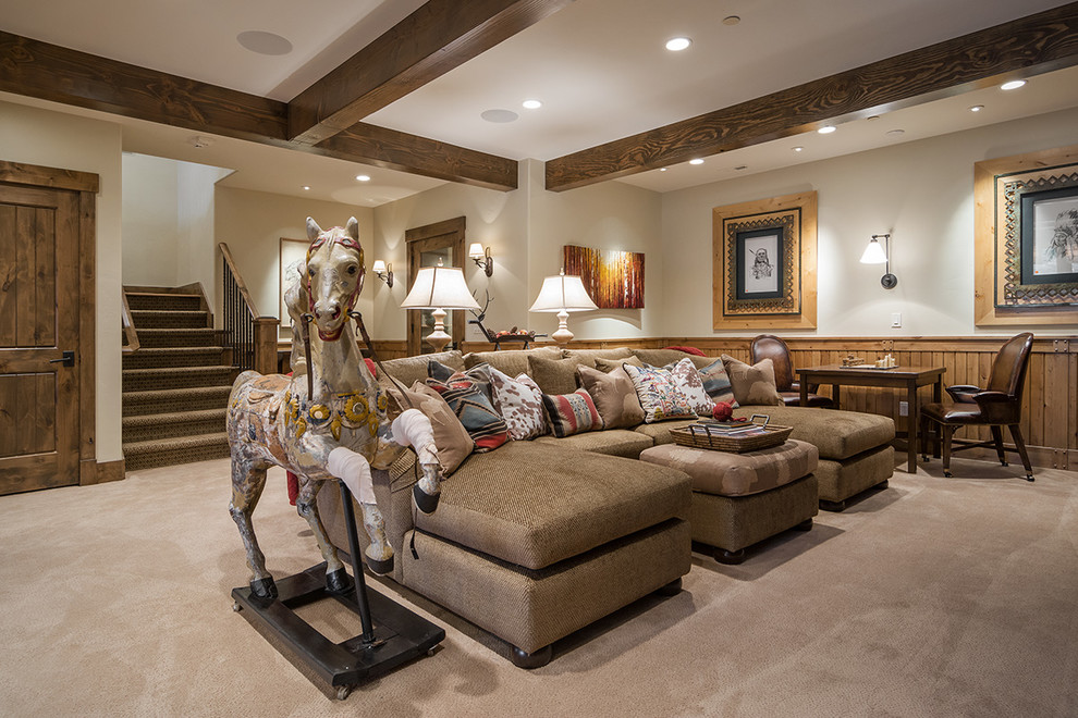 Photo of a large country open concept family room in Salt Lake City with a game room, white walls, carpet, a standard fireplace, a stone fireplace surround and a wall-mounted tv.