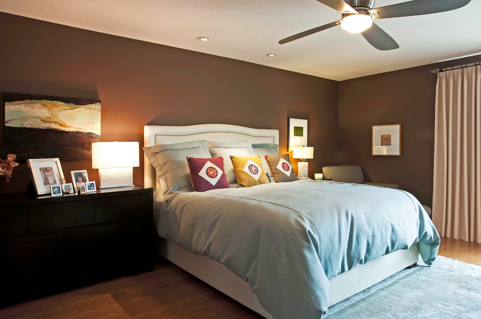 Inspiration for a large contemporary master bedroom in Los Angeles with brown walls and light hardwood floors.