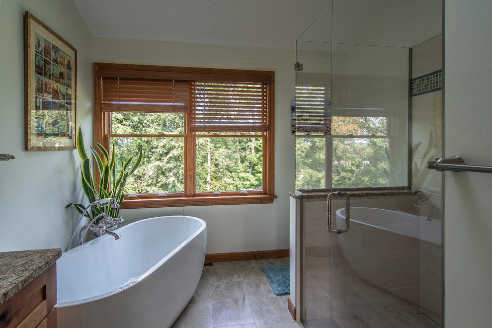This is an example of a country bathroom in Other with a freestanding tub, a curbless shower and a hinged shower door.