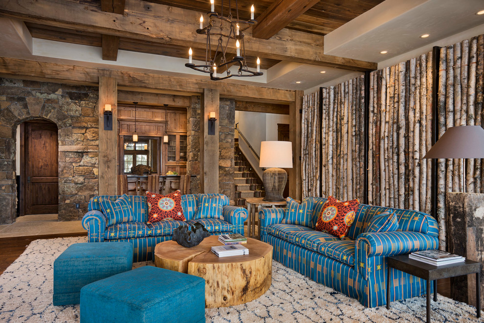 Design ideas for a country open concept family room in Other with brown walls and dark hardwood floors.