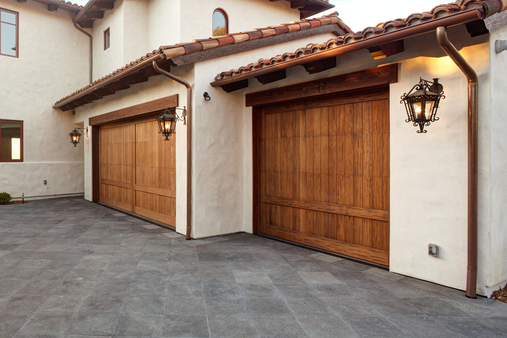 This is an example of a large mediterranean attached three-car garage in San Diego.