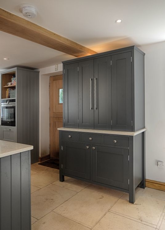 Design ideas for a large country open plan kitchen in Gloucestershire with a farmhouse sink, shaker cabinets, grey cabinets, granite benchtops, white splashback, stainless steel appliances, porcelain floors and a peninsula.