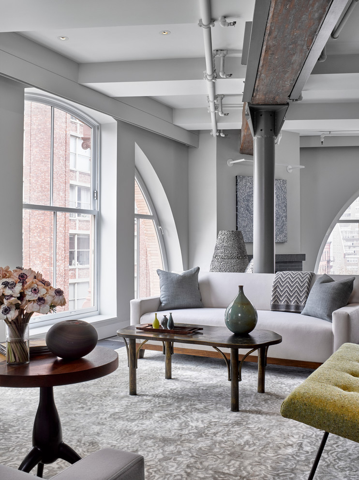 Photo of an industrial open concept living room in New York.