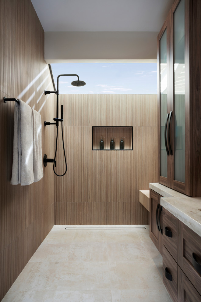 Inspiration for a mid-sized modern master brown tile and ceramic tile ceramic tile, beige floor and double-sink bathroom remodel in Orange County with shaker cabinets, medium tone wood cabinets, a one-piece toilet, an undermount sink, quartz countertops, beige countertops and a floating vanity
