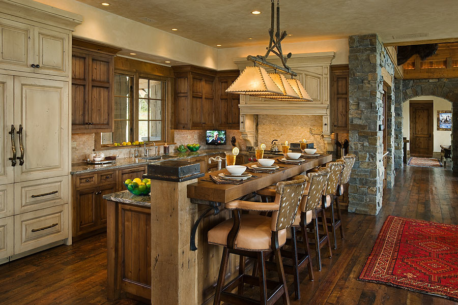 Photo of a large country eat-in kitchen in Other with beige cabinets, dark hardwood floors, with island and brown floor.