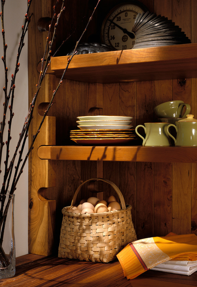 Inspiration for a large rustic l-shaped medium tone wood floor kitchen pantry remodel in Chicago with a farmhouse sink, recessed-panel cabinets, green cabinets, wood countertops, multicolored backsplash, stone tile backsplash, paneled appliances and an island