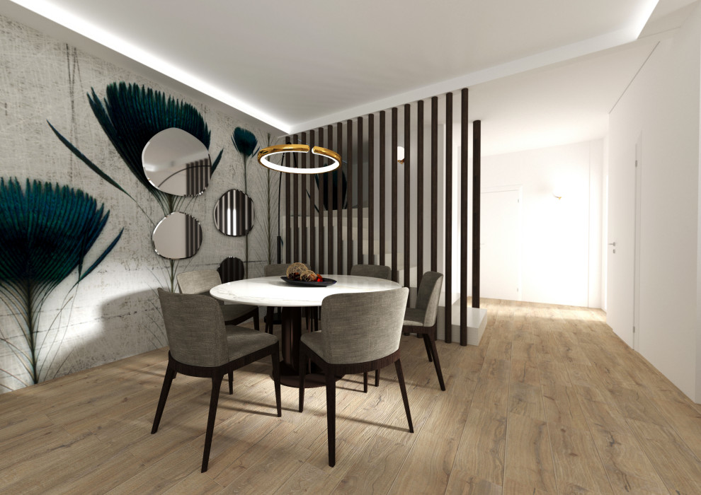 This is an example of a mid-sized contemporary dining room in Milan with white walls, porcelain floors, beige floor, recessed and decorative wall panelling.