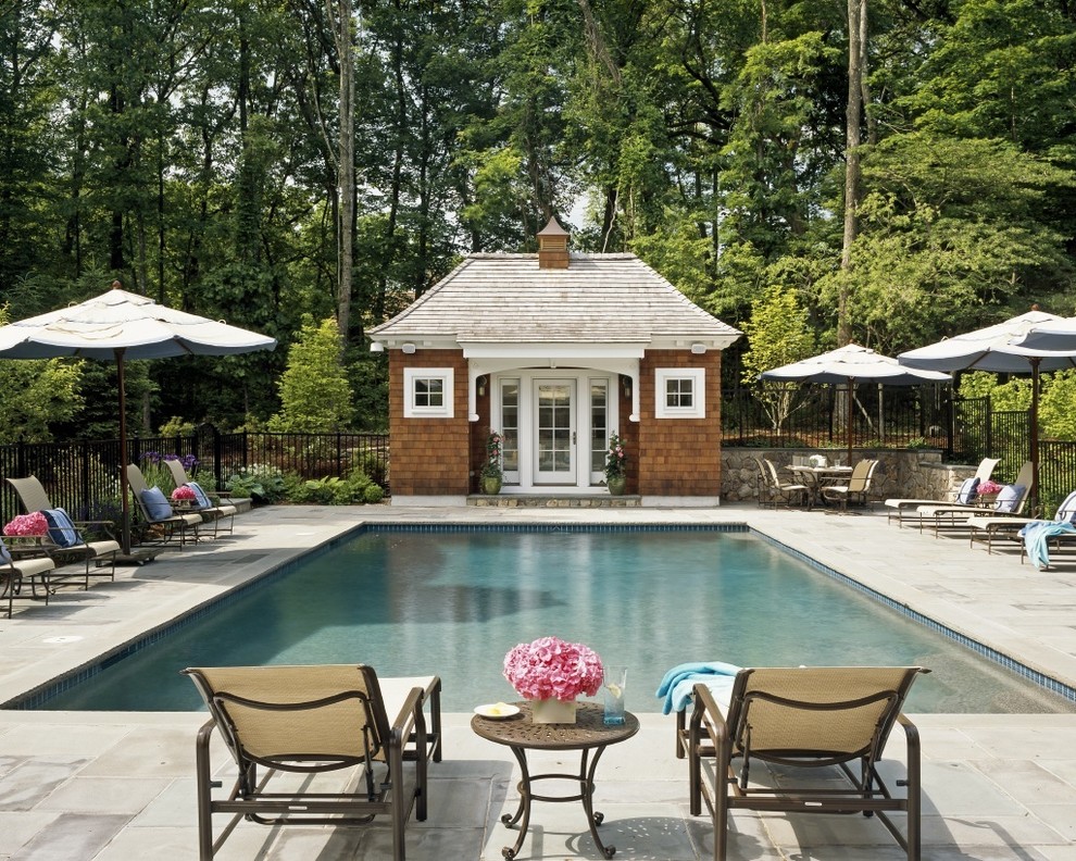 Design ideas for a traditional rectangular pool in Boston with a pool house.