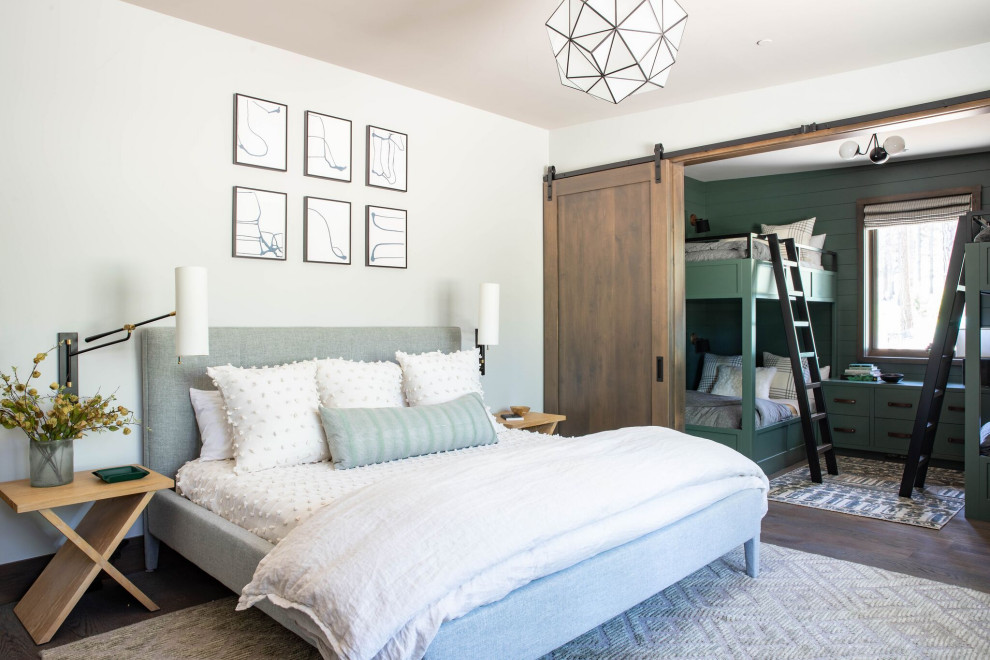 Transitional bedroom in San Francisco with white walls, dark hardwood floors and brown floor.