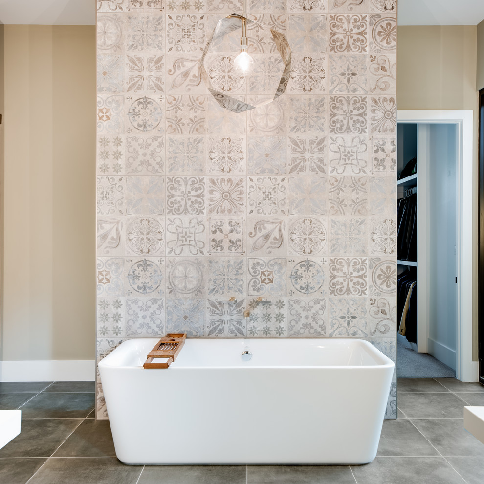 Inspiration for a mid-sized contemporary master bathroom in Dallas with flat-panel cabinets, brown cabinets, a freestanding tub, a double shower, a one-piece toilet, gray tile, porcelain tile, beige walls, porcelain floors, an undermount sink, engineered quartz benchtops, grey floor, a hinged shower door and white benchtops.