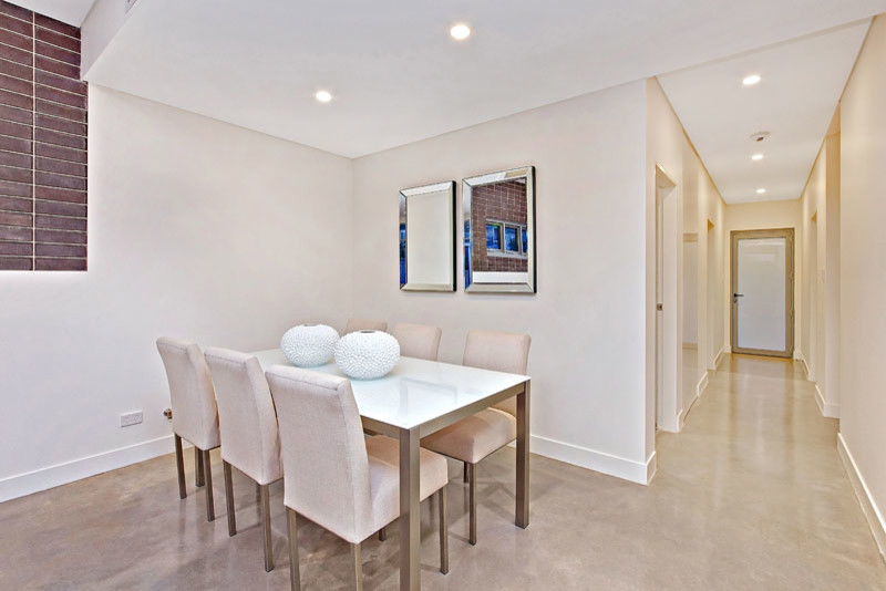 This is an example of a contemporary dining room in Sydney.
