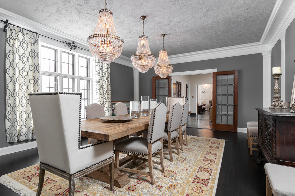 Design ideas for a transitional separate dining room in Other with grey walls, no fireplace and black floor.