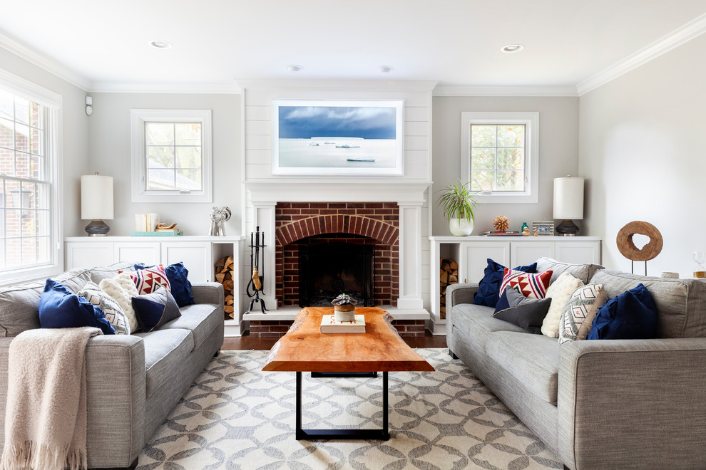 Mid-sized beach style formal living room in Chicago with grey walls, a standard fireplace and a brick fireplace surround.
