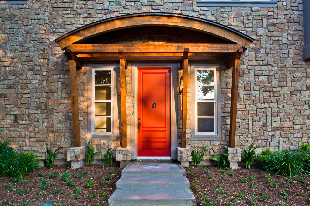 Photo of a transitional front door in Houston with a single front door and a red front door.