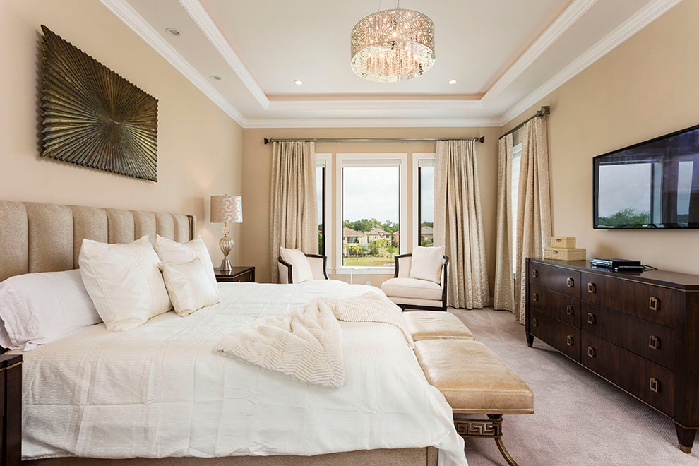 Transitional guest bedroom in Orlando with beige walls and carpet.