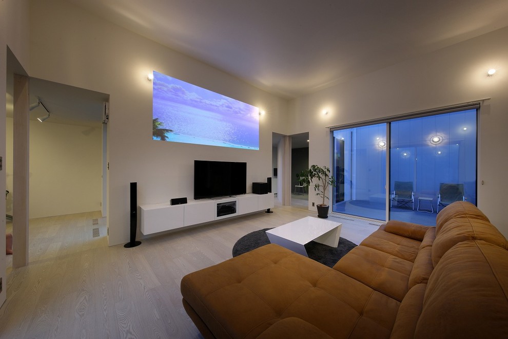 This is an example of a modern open plan home cinema in Other with white walls, plywood flooring, a projector screen and white floors.