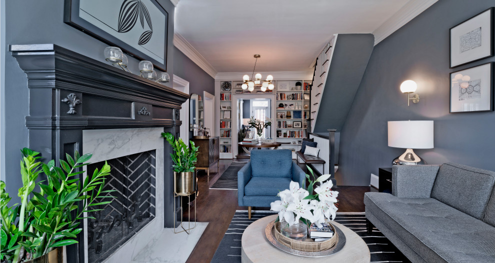 Small traditional enclosed living room in DC Metro with a library, grey walls, medium hardwood floors, a standard fireplace, a wood fireplace surround, a wall-mounted tv and brown floor.