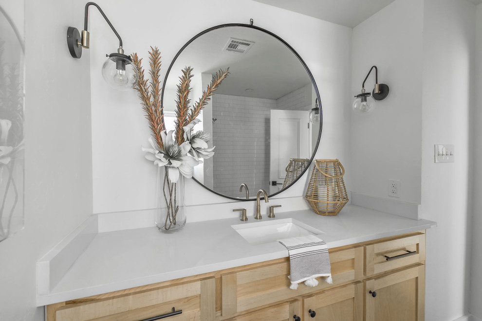 Design ideas for a mid-sized transitional powder room in Oklahoma City with shaker cabinets, beige cabinets, white walls, an undermount sink and white benchtops.