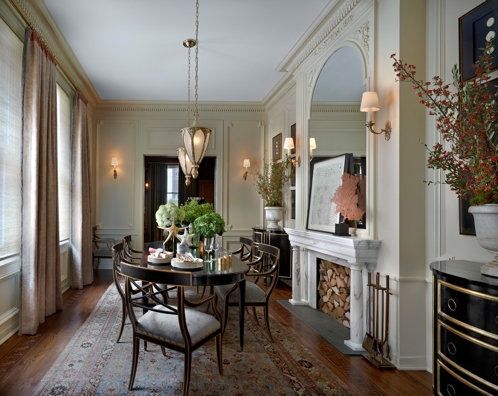 Design ideas for a traditional separate dining room in Chicago with beige walls and dark hardwood floors.