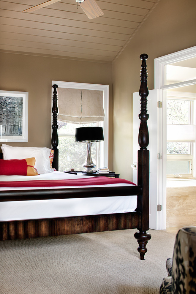 This is an example of a contemporary bedroom in Austin with carpet.