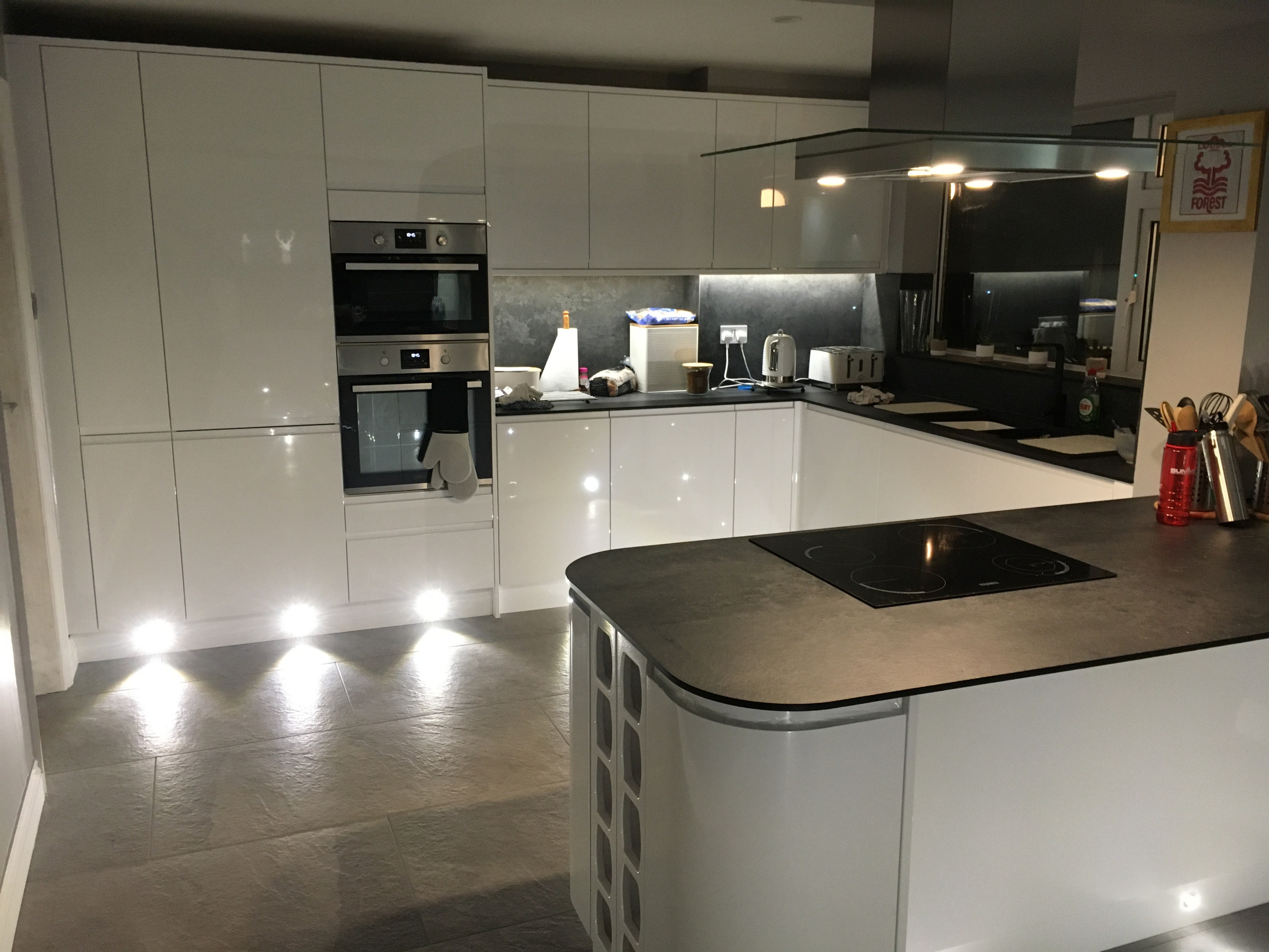 J pull handle Kitchen with compact laminate and porcelain floor tiles