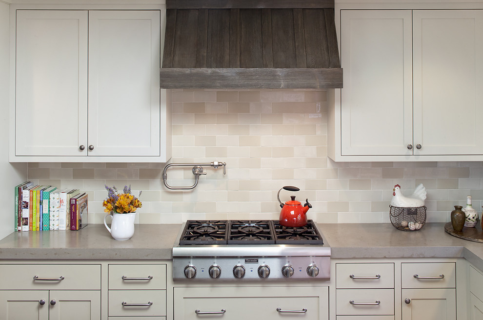 Traditional kitchen in San Francisco with beige splashback, subway tile splashback and concrete benchtops.