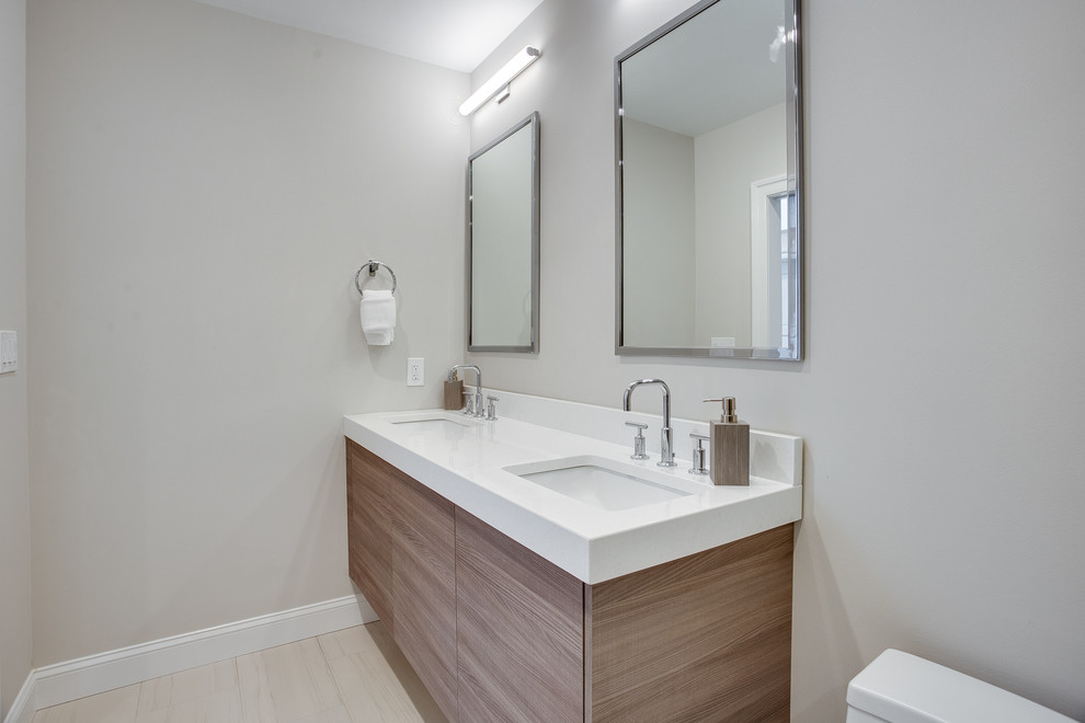 Design ideas for a small modern master bathroom in DC Metro with flat-panel cabinets, brown cabinets, a one-piece toilet, gray tile, porcelain tile, grey walls, porcelain floors, an undermount sink, engineered quartz benchtops, grey floor, a hinged shower door and yellow benchtops.