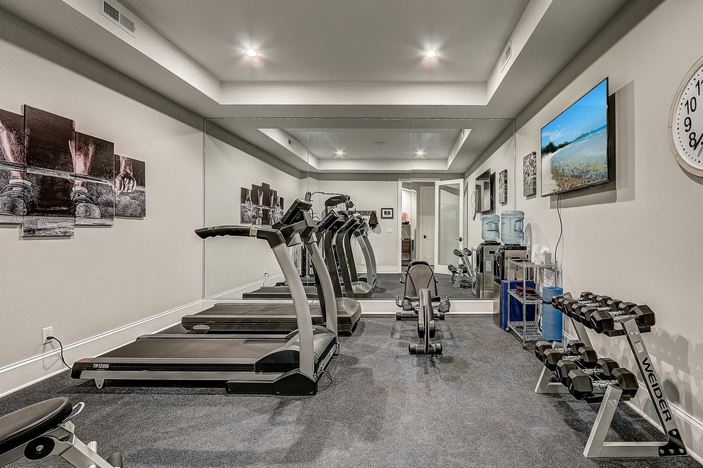 This is an example of a large beach style multipurpose gym in Milwaukee with grey walls, vinyl floors and grey floor.