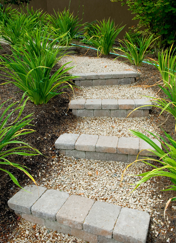 This is an example of a contemporary front yard gravel garden path in Seattle.