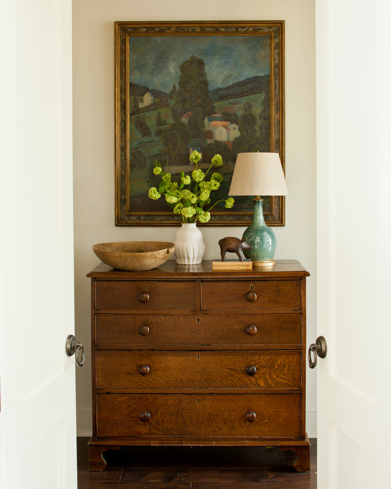 Example of a large farmhouse dark wood floor hallway design in Nashville with beige walls