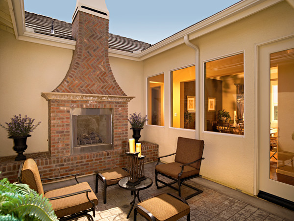 Mid-sized traditional courtyard patio in San Francisco with a fire feature, concrete pavers and no cover.