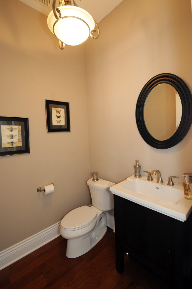 Design ideas for a traditional powder room in Other with beige walls.